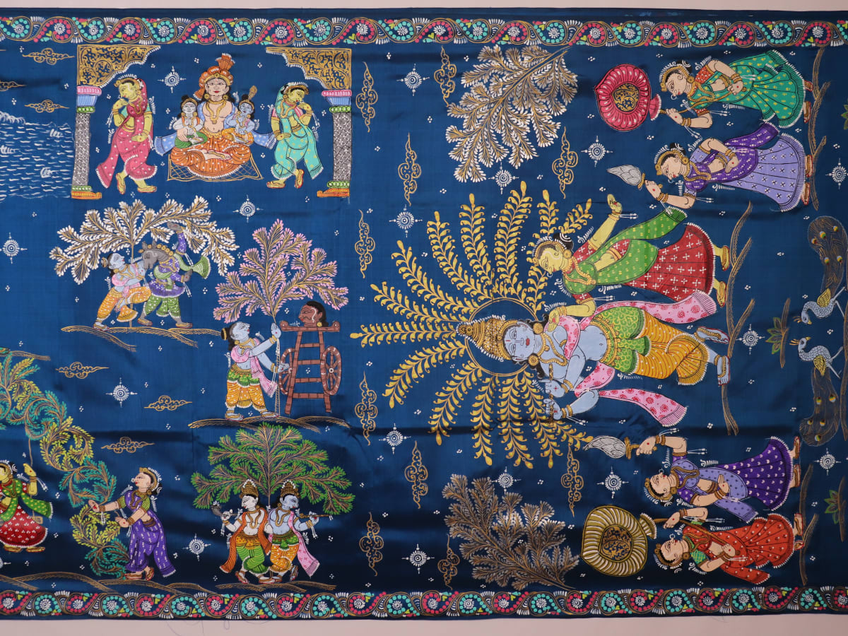 Close-up of the handwoven blue Patachitra silk saree, showcasing the detailed texture of the fabric.
