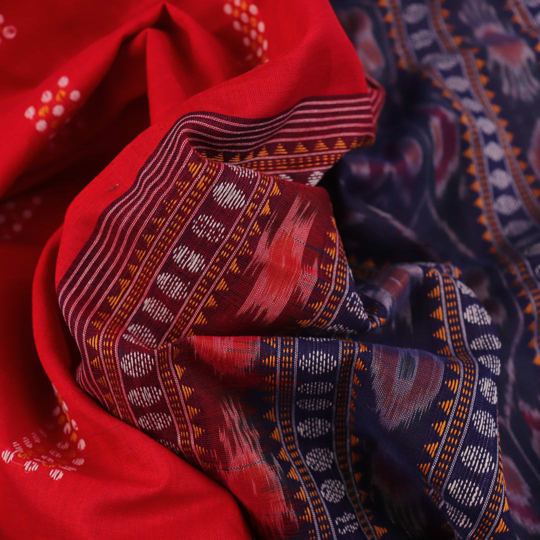 Red Bomkai cotton saree with purple butta pattern, displayed full length.