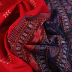 Red Bomkai cotton saree with purple butta pattern, displayed full length.
