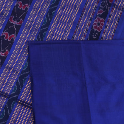 Close-up of plain blue Sambalpuri silk handloom saree fabric texture.