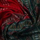 Full view of a red and green Bomkai cotton saree with a butta pattern