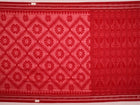 Red and green cotton Sambalpuri saree with traditional motifs draped on a model