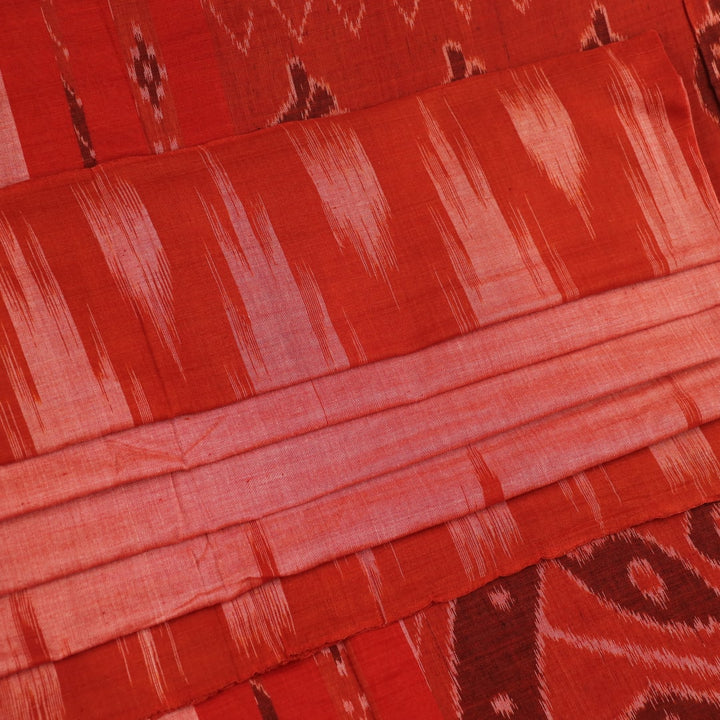 Styling view of a plain multi-color & rust Sambalpuri cotton saree.