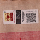Close-up of plain red and off-white Tussar silk saree fabric texture.