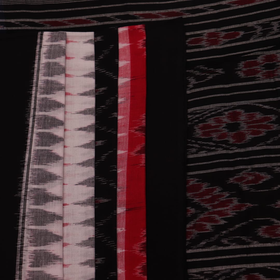 Saree styling: A red and black Sambalpuri cotton handloom saree with motifs is beautifully draped.