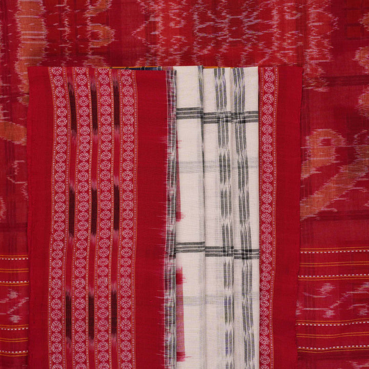 Model wearing a white and red Sambalpuri cotton saree with traditional motifs, styled for an elegant look.
