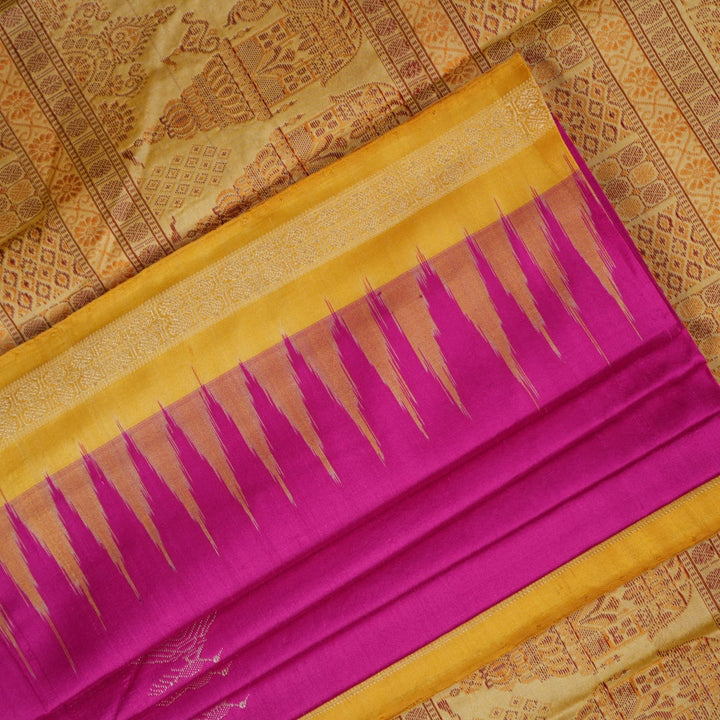 Close-up of the luxurious Bomkai silk saree fabric texture and weave in pink and yellow.