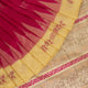 Close-up texture of pink and cream handloom Bomkai silk saree with butta pattern.