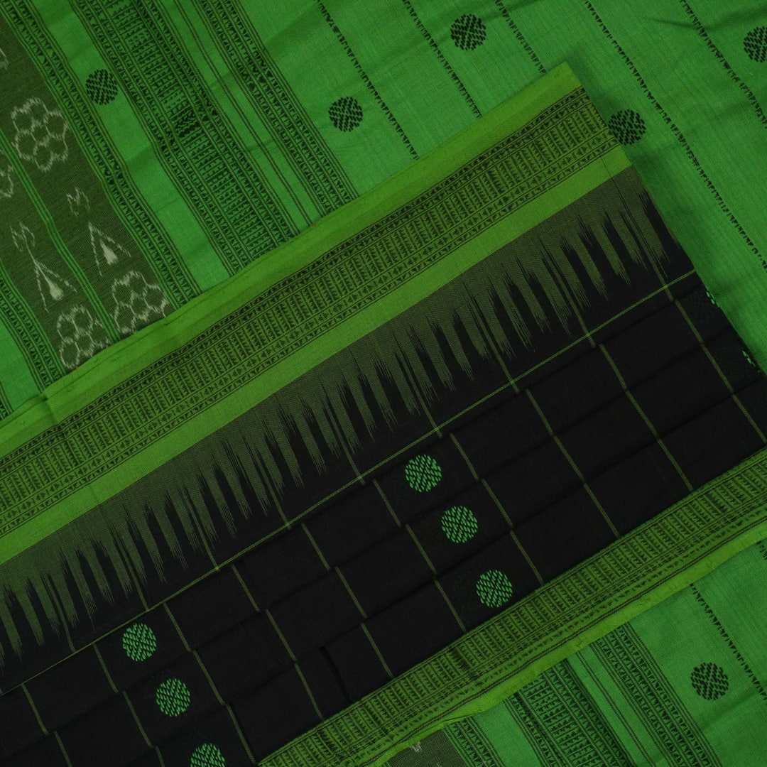 Full flat layout of a black Sambalpuri cotton saree with green butta patterns and an intricate ikat border.