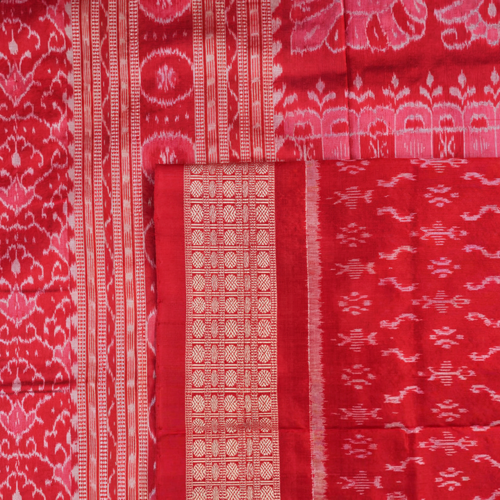 Close-up of the luxurious silk fabric texture and distinctive Sambalpuri ikat weave of the blue Pasapalli saree.