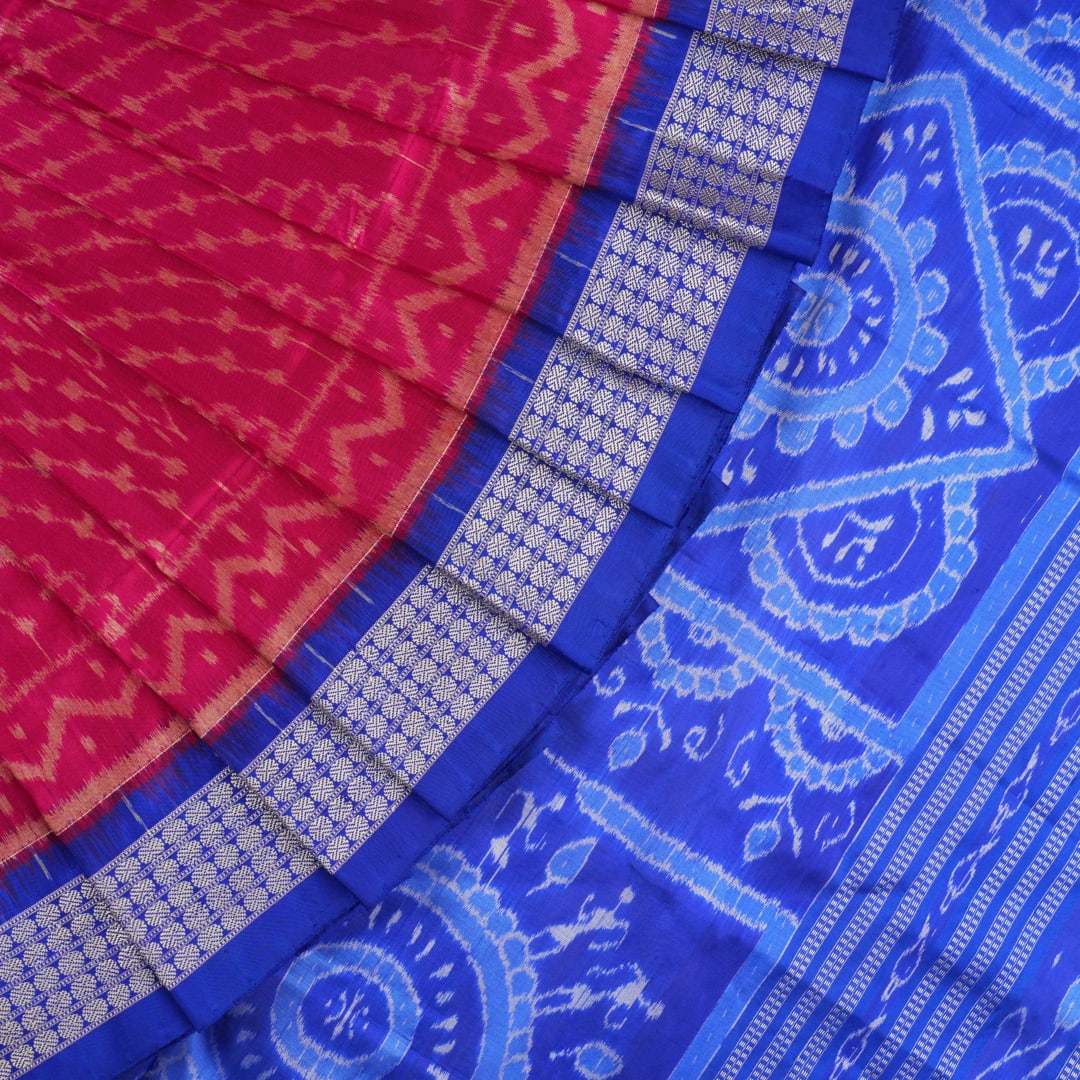 Close-up of Sambalpuri silk fabric texture, revealing the fine handloom weave and quality.