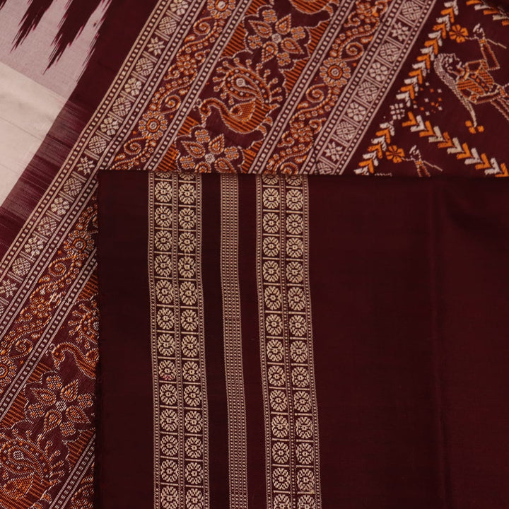 Close-up view of the woven fabric texture, showcasing the intricate butta patterns on the white silk body.