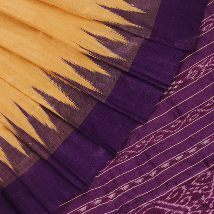 Close-up of cream tussar silk saree fabric with plain weave texture