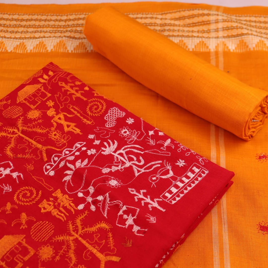 Close-up view of the yellow blouse piece with red doll patterns in Sambalpuri style cotton dress material