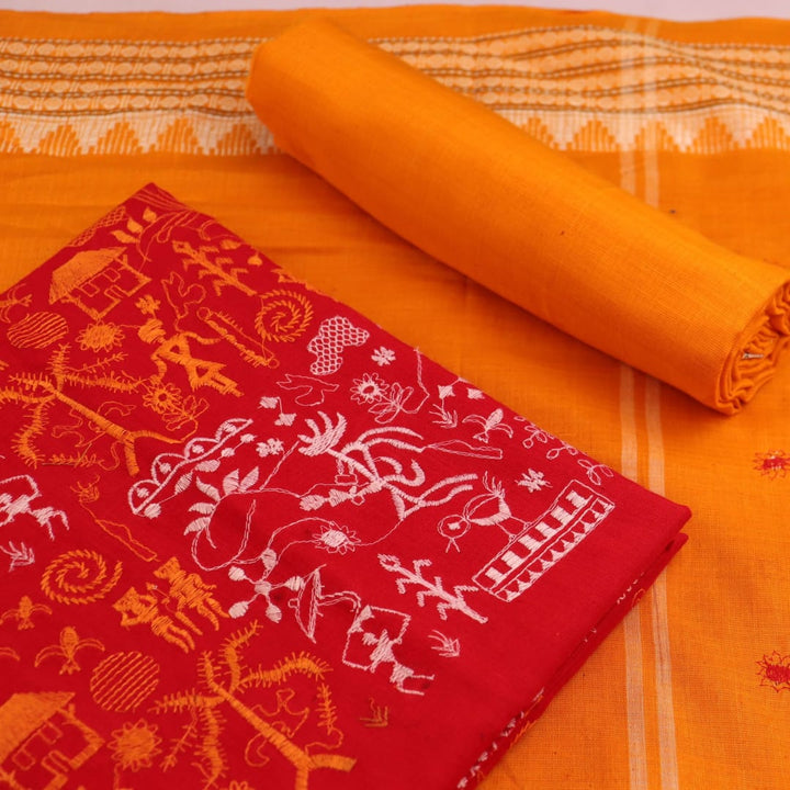 Close-up view of the yellow blouse piece with red doll patterns in Sambalpuri style cotton dress material