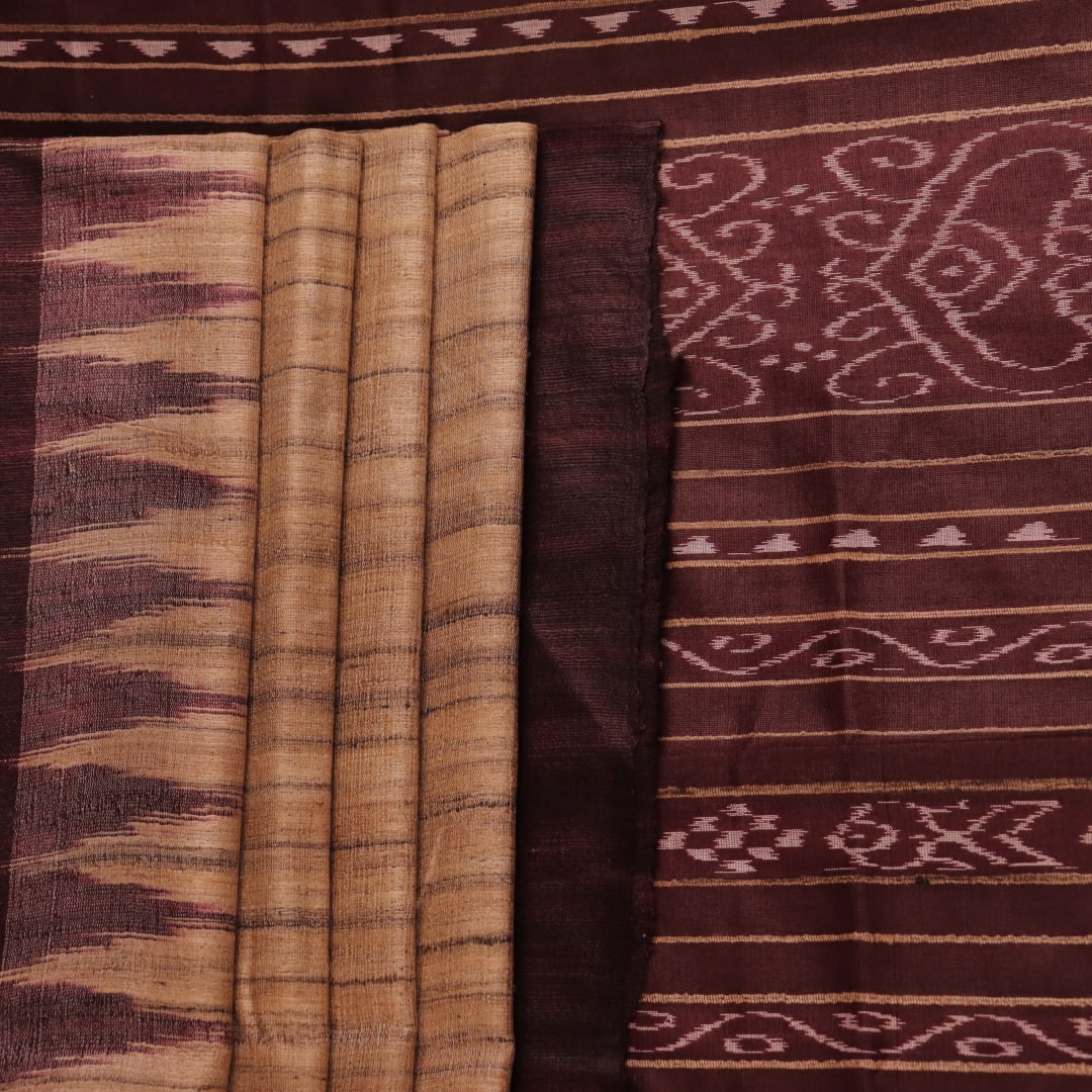 Close-up view of the textured Tussar Silk fabric of a Cream and Maroon Plain Tussar Saree