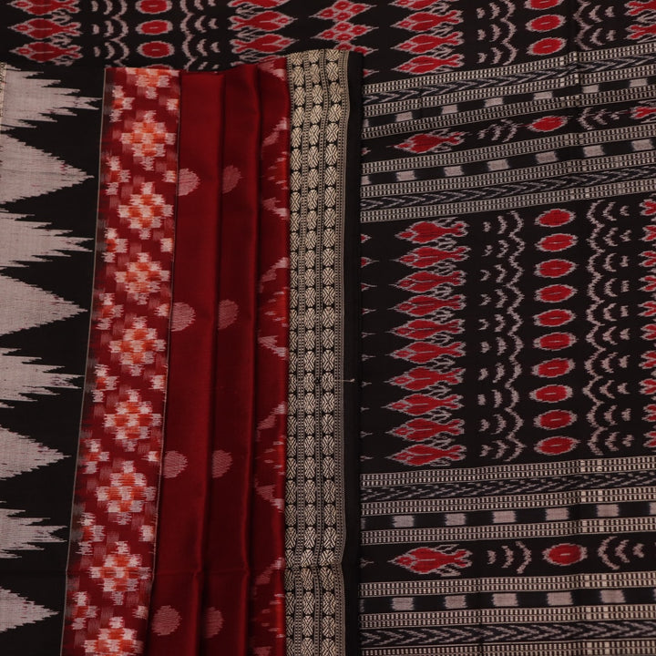 Close-up view of maroon and black silk Sambalpuri saree fabric showcasing intricate motifs