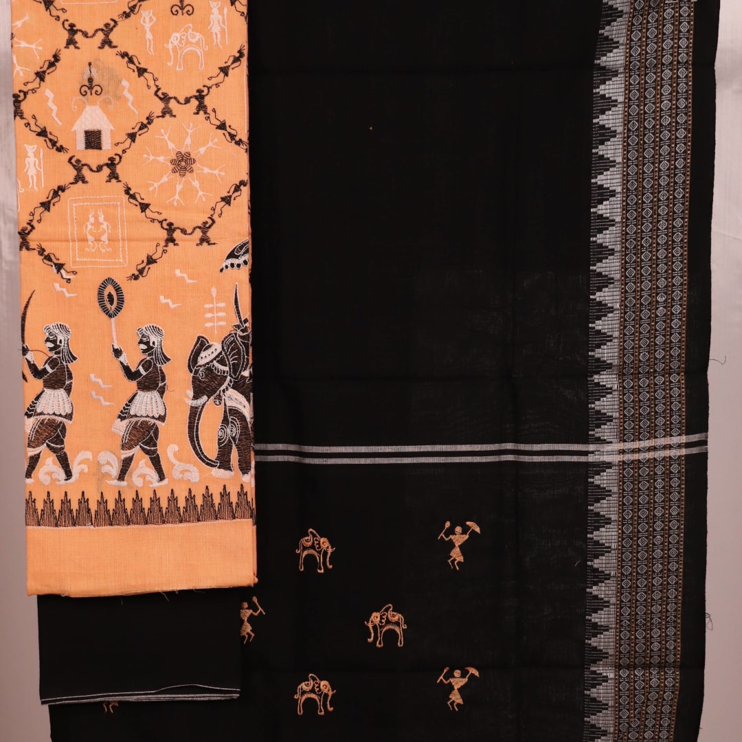 Detailed view of a Sambalpuri cotton dress material in brown and black, showcasing the doll-patterned design on the body.