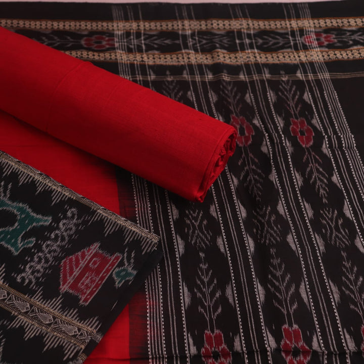 Detail of the black Sambalpuri cotton dress material's blouse piece with red motifs.