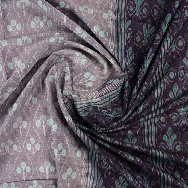 Full product layout of the grey and blue Sambalpuri cotton saree showing body motifs and pallu detail.