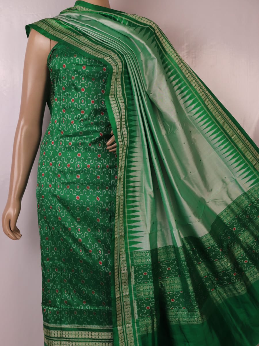 Close-up of the green Sambalpuri silk dress material blouse piece, detailed with traditional motifs.