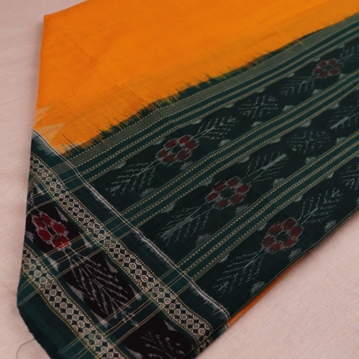 Yellow Sambalpuri cotton dupatta styled with a green blouse piece, draped over a model