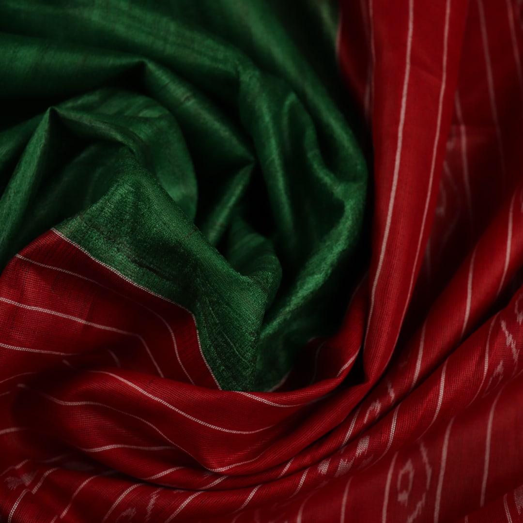 Close-up of green and red tussar silk saree fabric texture