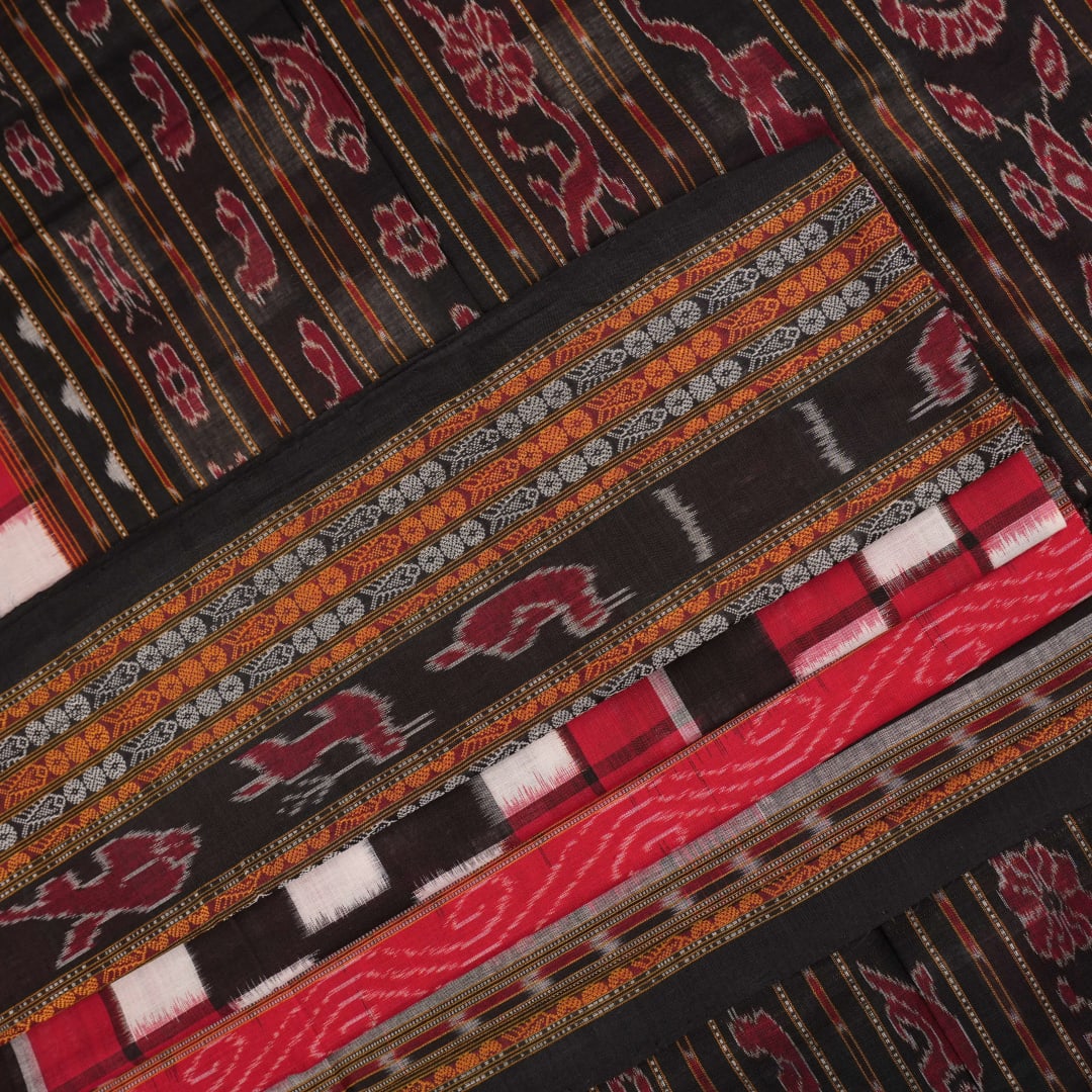 Model draped in a maroon and black pasapalli Sambalpuri cotton saree showcasing traditional Odisha style.