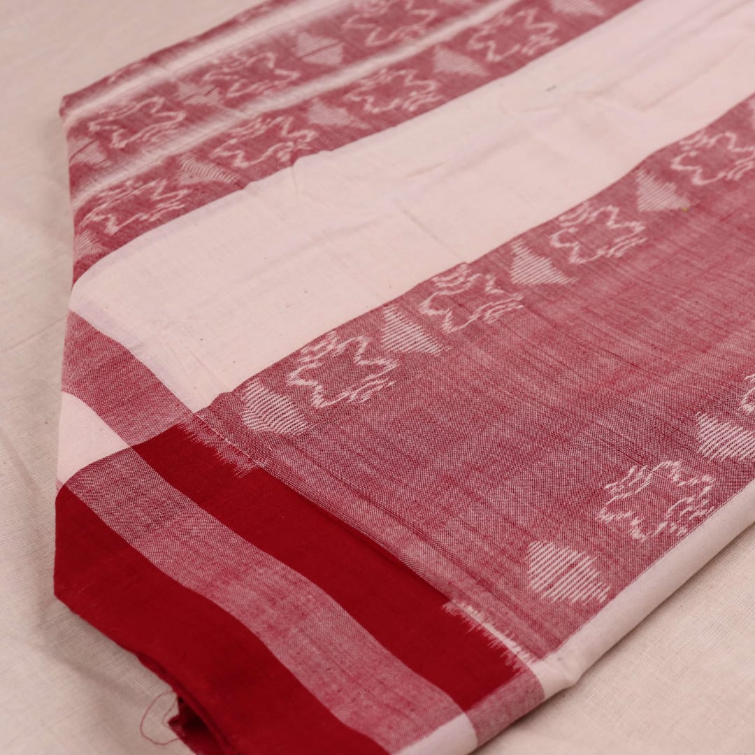 White and red Sambalpuri cotton dupatta with intricate motif patterns, draped over a traditional outfit