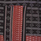 Full styling view of a model draped in a brown and black Sambalpuri cotton saree with traditional motifs.