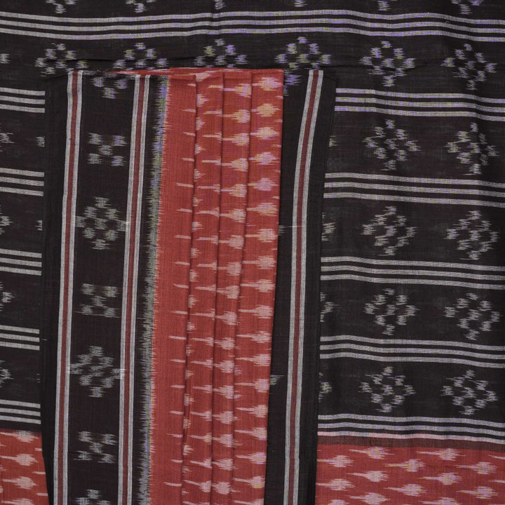 Full styling view of a model draped in a brown and black Sambalpuri cotton saree with traditional motifs.