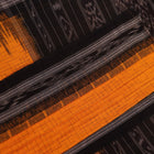 Styling view of a plain yellow and black Sambalpuri cotton saree, highlighting its elegant drape.