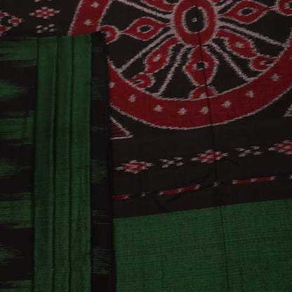 Green and black plain Sambalpuri cotton saree gracefully draped on a model, highlighting its elegant styling.