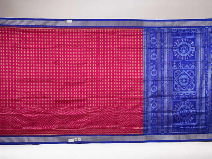 Close-up of Sambalpuri silk fabric texture, revealing the fine handloom weave and quality.