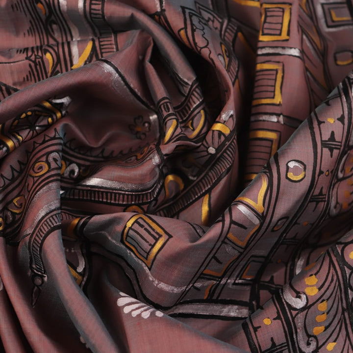 Close-up of multicolored Patachitra silk saree fabric texture showing hand-painted details.
