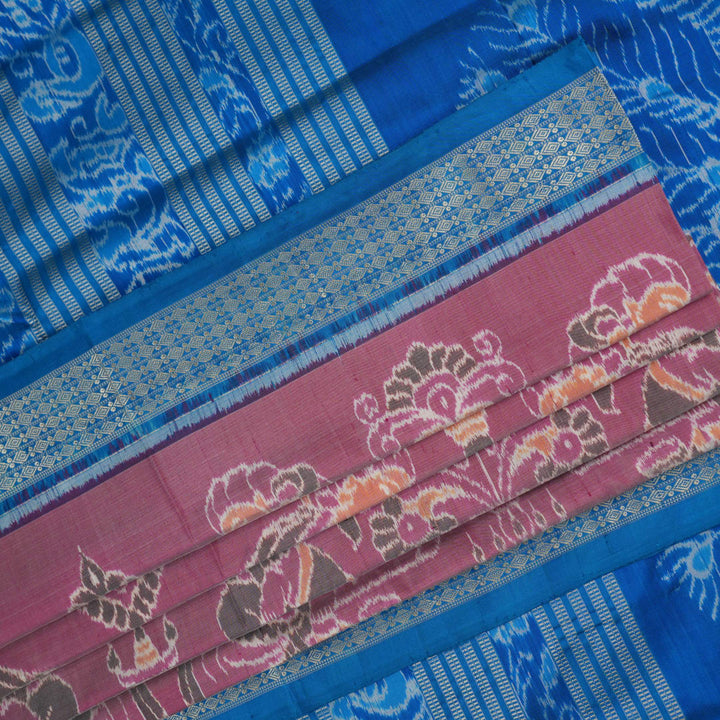 Close-up of the multi-color blue Sambalpuri silk saree fabric texture, highlighting intricate weave.