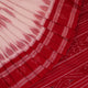 White and red cotton Sambalpuri Saree with motifs, elegantly draped.