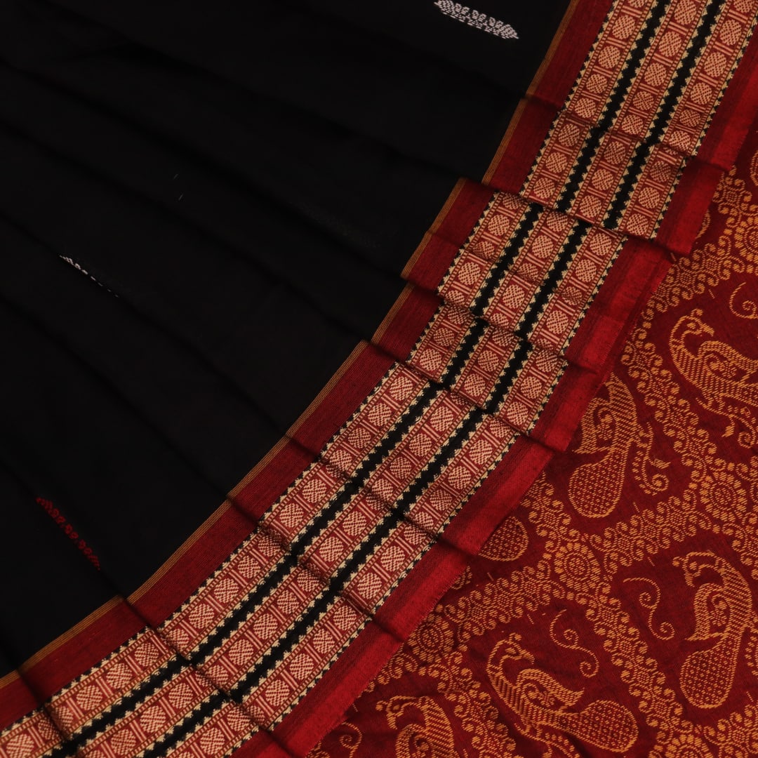 Full view of a black cotton Bomkai saree with rust-colored butta patterns and pallu.