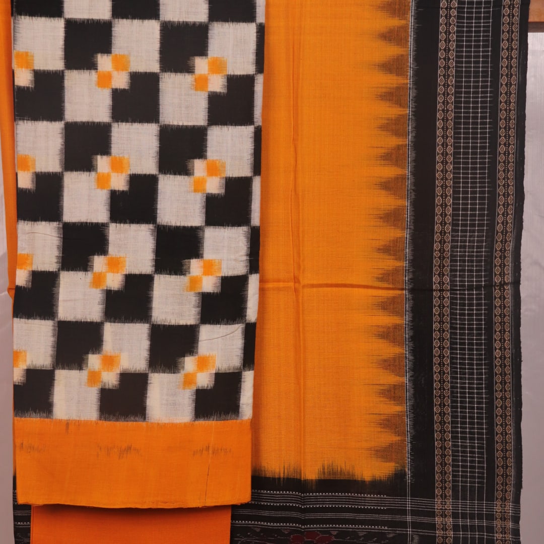 Detail of the white and yellow Sambalpuri cotton dress material blouse piece, showing motifs.
