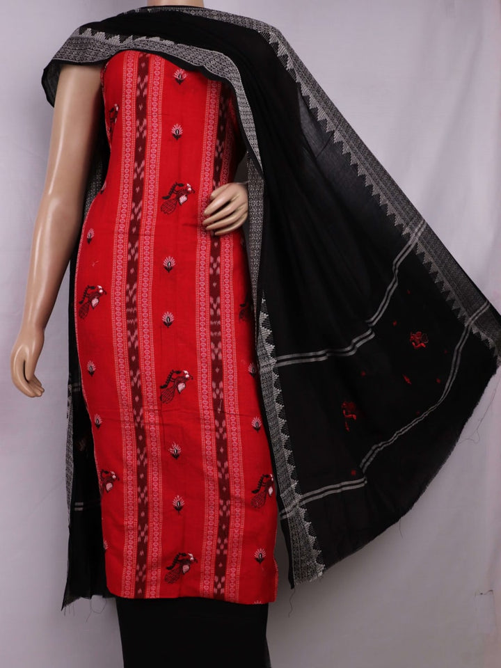 Close-up of red cotton Sambalpuri dress material with intricate black motifs