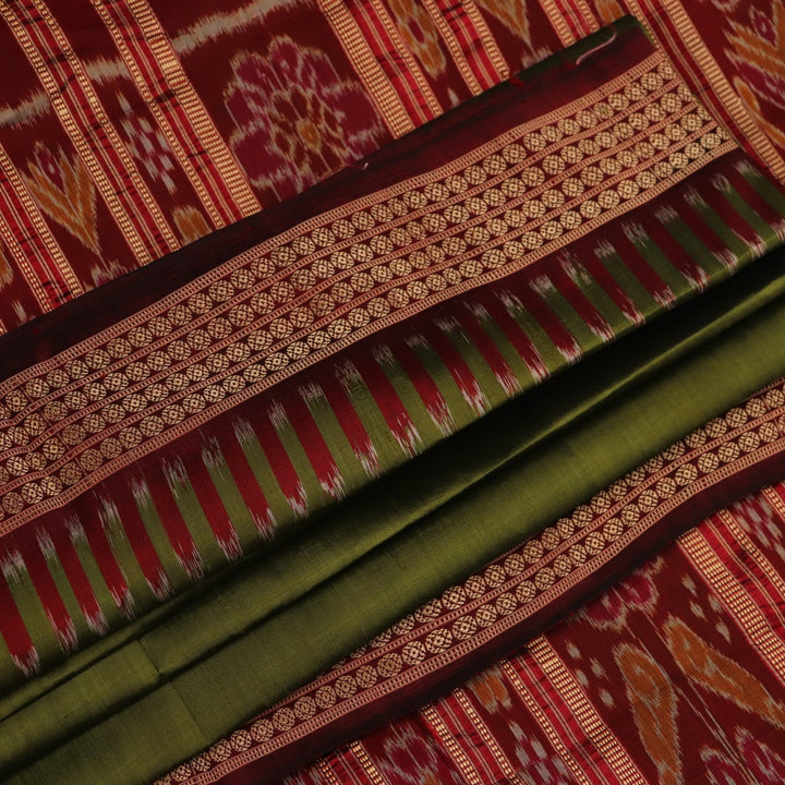 Styling view of vibrant green Khandua silk saree with maroon butta pattern