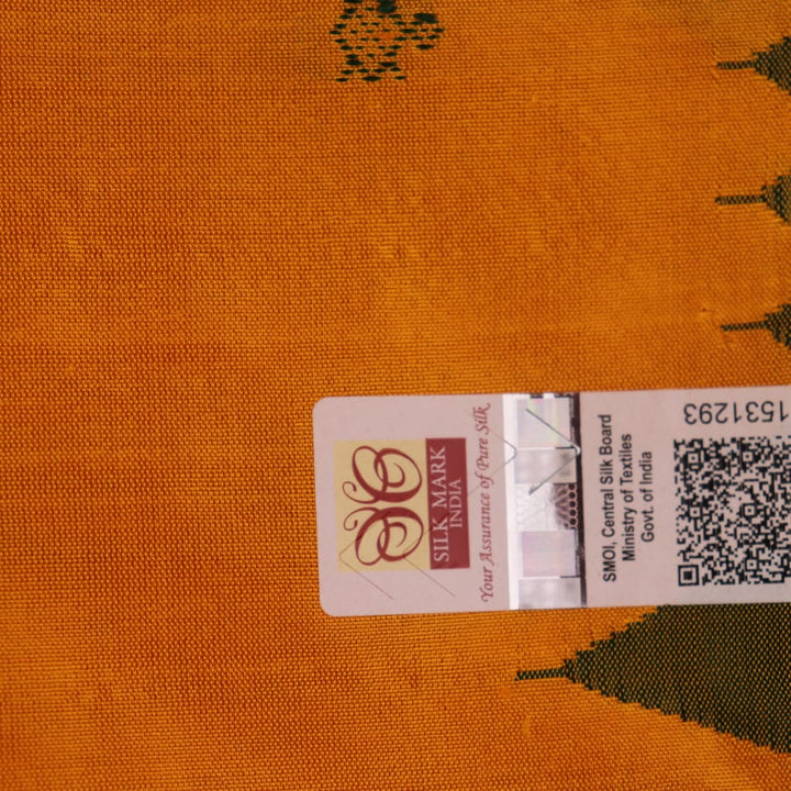 Close-up of yellow & green Sambalpuri Silk Saree fabric texture, showing Butta pattern.
