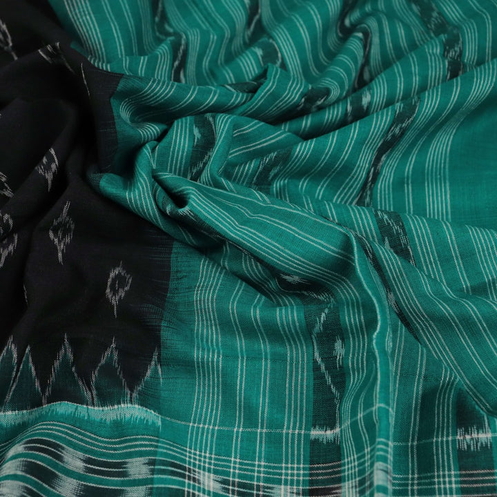 Styling view of a black and green Sambalpuri cotton dupatta with intricate motifs