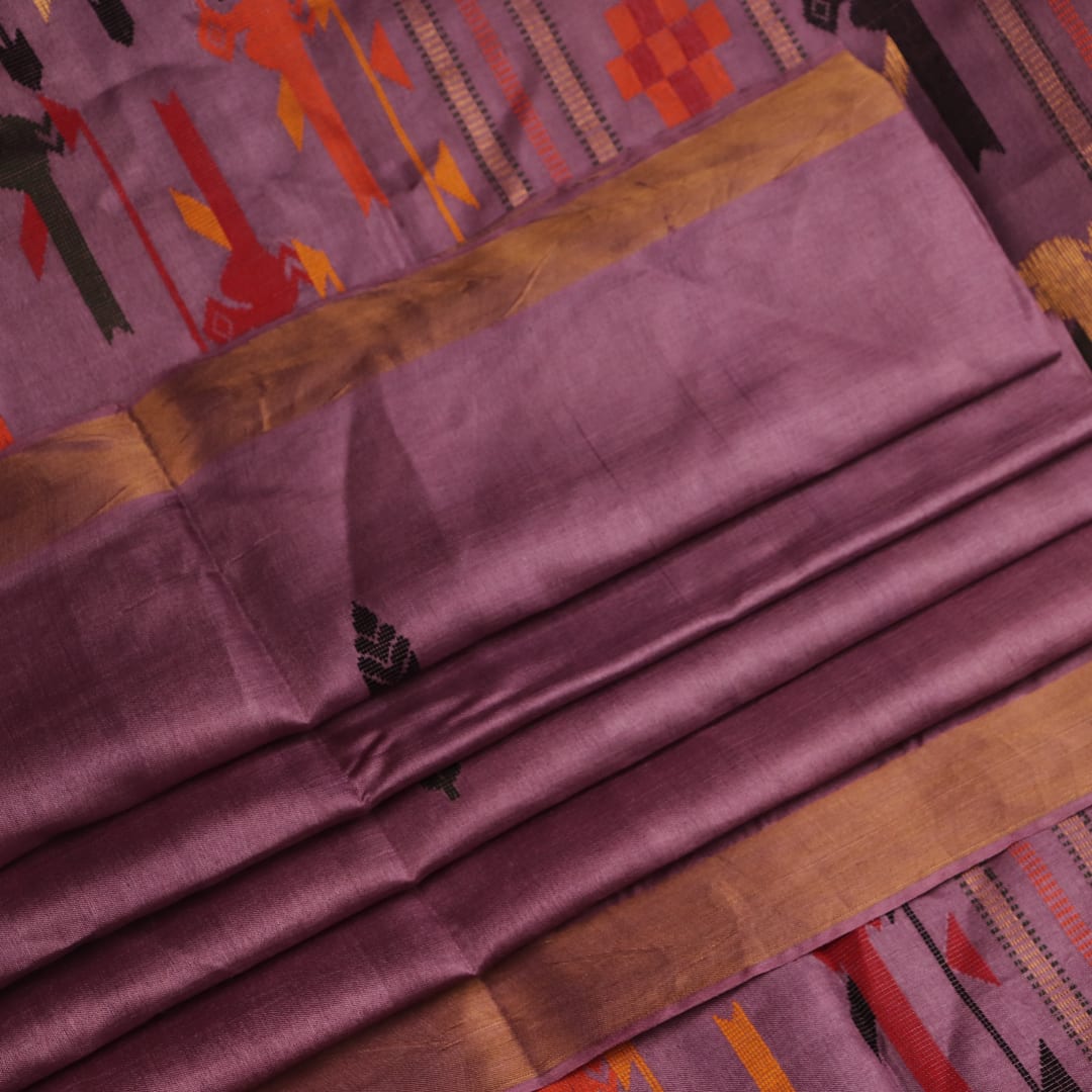 Close-up view of the textured Tussar silk fabric of the saree