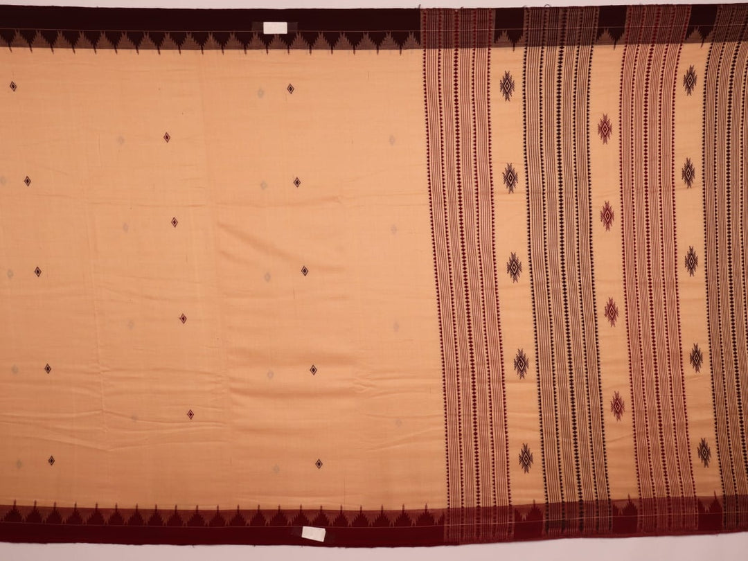 Full view of a cream-colored handloom Kotpad cotton saree with maroon butta patterns