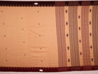 Full view of a cream-colored handloom Kotpad cotton saree with maroon butta patterns