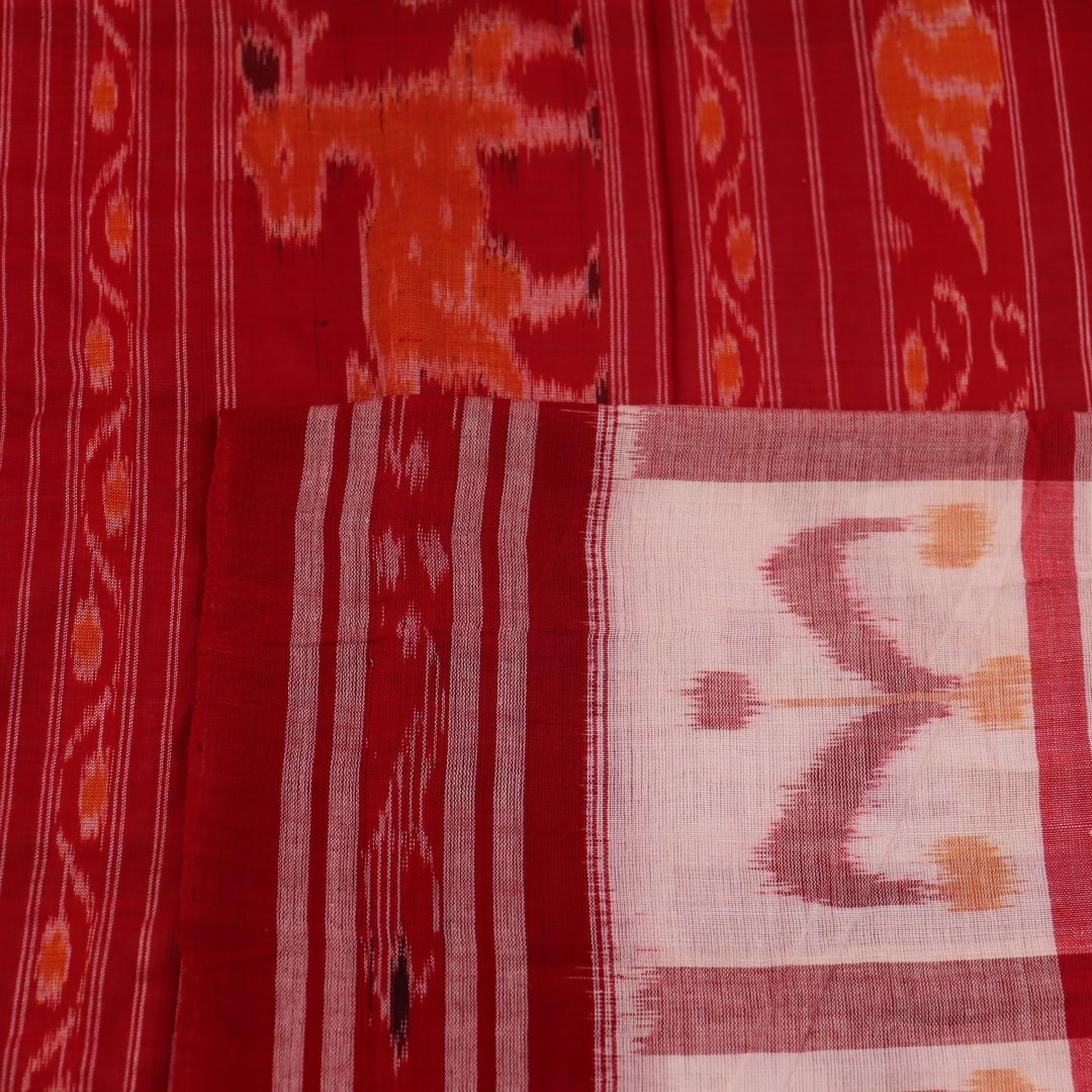 Full view of a white and red Sambalpuri cotton saree with traditional motifs.