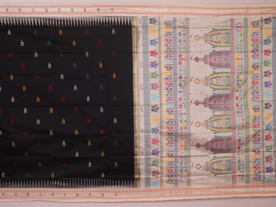 Close-up texture of black and white Bomkai silk saree with butta pattern.
