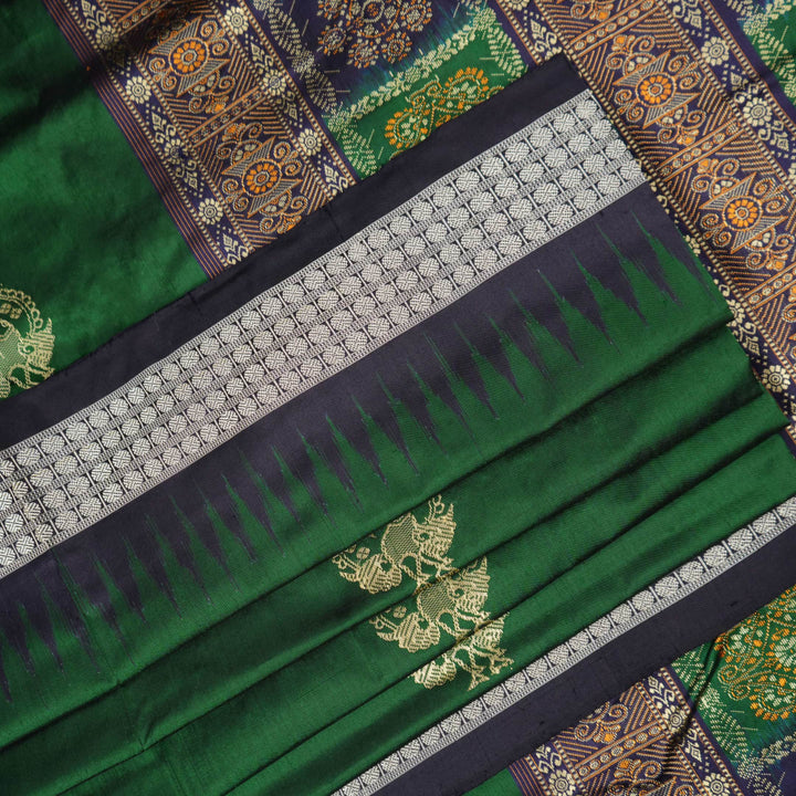 Close-up of Bomkai silk saree fabric, revealing rich texture and intricate handloom weave details.