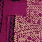 Close-up of magenta Tussar silk saree fabric, showing the printed pattern and natural slub texture.